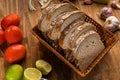 Sliced white bread with wheat flour on a wooden table. Chamado PÃÂ£o de forma