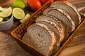 Sliced white bread with wheat flour on a wooden table. Chamado PÃÂ£o de forma