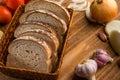 Sliced white bread with wheat flour on a wooden table. Chamado PÃÂ£o de forma