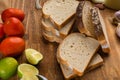 Sliced white bread with wheat flour on a wooden table. Chamado PÃÂ£o de forma