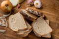 Sliced white bread with wheat flour on a wooden table. Chamado PÃÂ£o de forma