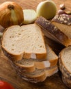 Sliced white bread with wheat flour on a wooden table. Chamado PÃÂ£o de forma