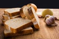 Sliced white bread with wheat flour on a wooden table. Chamado PÃÂ£o de forma