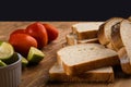 Sliced white bread with wheat flour on a wooden table. Chamado PÃÂ£o de forma