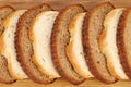 Sliced white and brown loaf of bread. Royalty Free Stock Photo