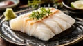 Sliced White Fish Sashimi on Dark Plate Royalty Free Stock Photo