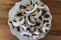 Sliced white mushrooms on rustic bowl Royalty Free Stock Photo