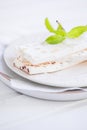 Sliced white nougat with almonds on wooden table Royalty Free Stock Photo