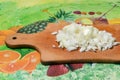 Sliced white onion on the board during the preparation of meals. Protection against the flu and colds.