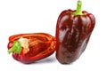 Sliced and whole dark-red sweet bell peppers