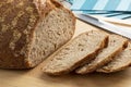 Sliced whole fresh baked German dinkel wheat bread on a cutting board Royalty Free Stock Photo