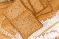 Sliced whole grain bread for toasting with ears and flour