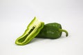 Sliced and whole green bell pepper