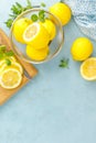 Sliced and whole lemons with mint