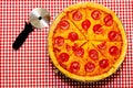 Sliced Whole Pepperoni Pizza with Cutter Royalty Free Stock Photo