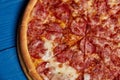 Sliced whole salami pizza. Royalty Free Stock Photo