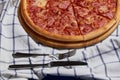 Sliced whole salami pizza. Royalty Free Stock Photo