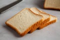 Sliced Whole Wheat White Bread on a gray background, side view. Close-up Royalty Free Stock Photo