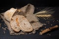 Sliced yeast grain bread with oats on dark concrete background Royalty Free Stock Photo