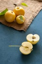 Sliced yellow apple on a blue background Royalty Free Stock Photo