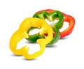 Sliced yellow green red bell pepper on white background Royalty Free Stock Photo