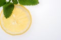 Sliced yellow lemon with leaves of fresh lemon balm Melissa officinalis Royalty Free Stock Photo