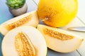 Sliced yellow melon on wood Royalty Free Stock Photo