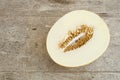 Sliced yellow melon a a wooden table