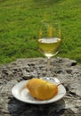 Sliced yellow pear and glass of wine