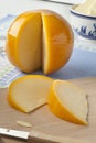 Sliced yellow round Edam cheese