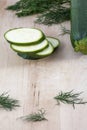 Sliced zucchini with dill on the wooden background Royalty Free Stock Photo