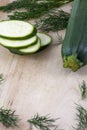 Sliced zucchini with fennel on wooden background Royalty Free Stock Photo
