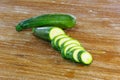 Sliced zuccini on wooden background Royalty Free Stock Photo