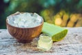 Slices of a aloe vera leaf and a bottle with transparent gel for Royalty Free Stock Photo