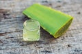 Slices of a aloe vera leaf and a bottle with transparent gel for medicinal purposes, skin treatment and cosmetics, close Royalty Free Stock Photo