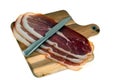 Slices of Aosta ham on a cutting board on white background Royalty Free Stock Photo