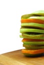 Slices of apple, kiwi and orange stacked in a tower Royalty Free Stock Photo