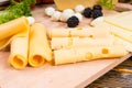 Slices of assorted rolled cheese