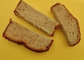 Slices of banana bread on a yellow kitchen cutting board Royalty Free Stock Photo