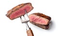 Slices of beef steak on a fork isolated on clean and white background Royalty Free Stock Photo