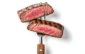 Slices of beef steak on a fork isolated on clean and white background Royalty Free Stock Photo