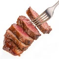 Slices of beef steak on a fork isolated on white background Royalty Free Stock Photo