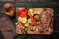 Slices of beef steak with grilled vegetables and brandy Royalty Free Stock Photo