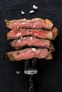 Slices beef Steak Ribeye on meat fork Royalty Free Stock Photo