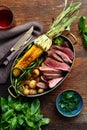 Slices beef steak in frying pan with vegetables and red wine Royalty Free Stock Photo