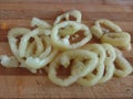 Slices of bell pepper on the wooden background in macro. Chopped bell pepper on a cutting board.