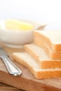 Slices of bread with bowl of butter Royalty Free Stock Photo