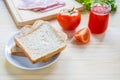 slices of bread with jam and ham, tamoto, lettuce. Royalty Free Stock Photo