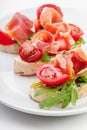 Slices of Bread with Spanish Serrano Ham Royalty Free Stock Photo