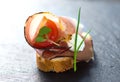 Slices of Bread with Spanish Serrano Ham Served as Tapas. Appetizer. Prosciutto Royalty Free Stock Photo